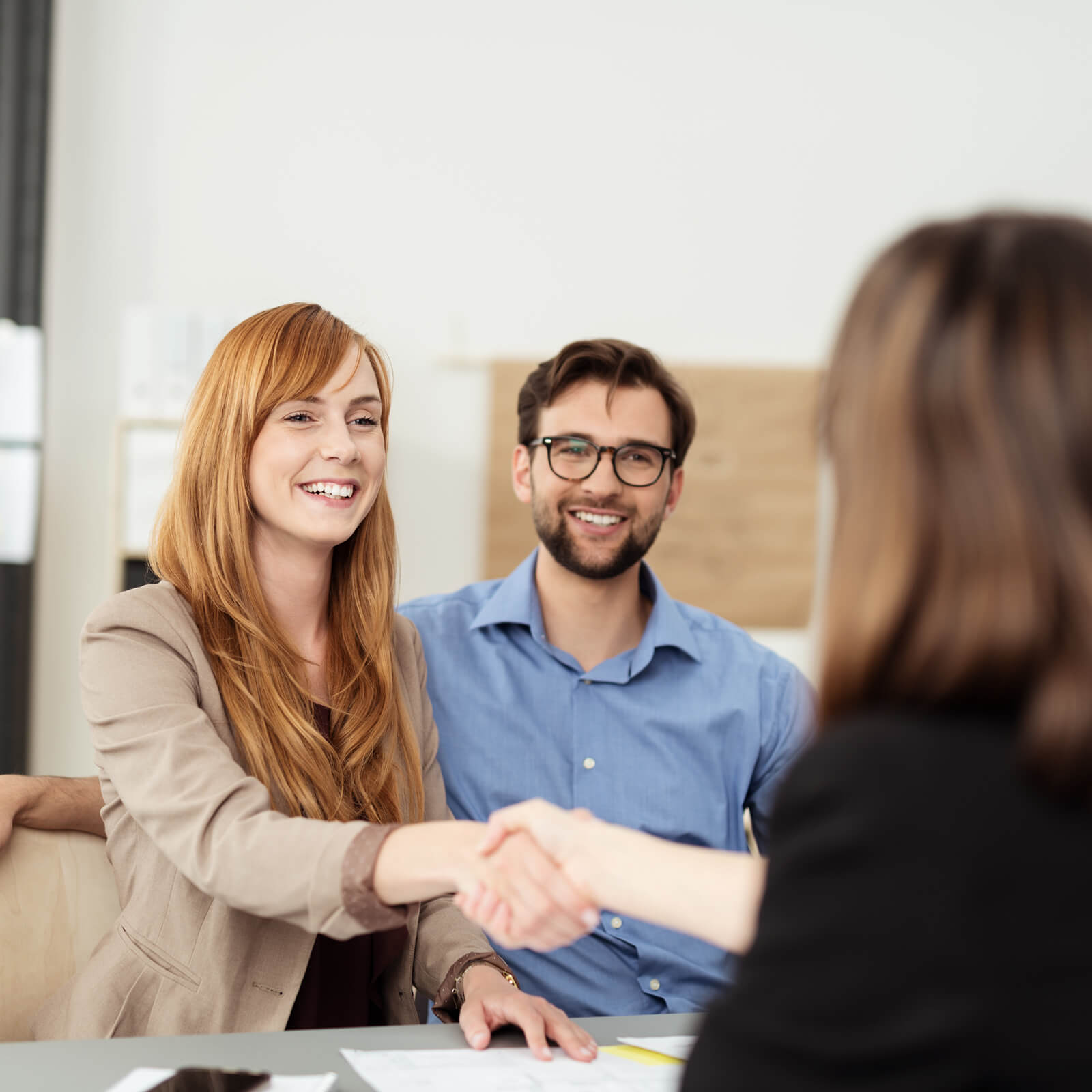 Couple shaking hands with salesperson | Kirkland's Flooring| Kirkland's Flooring