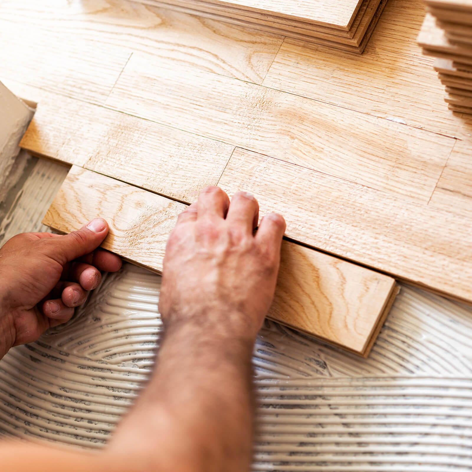 Gluing down hardwood flooring for installation Evans, GA | Kirkland's Flooring