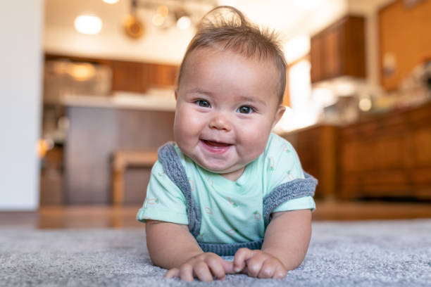 Baby lying on carpet flooring | Kirkland's Flooring