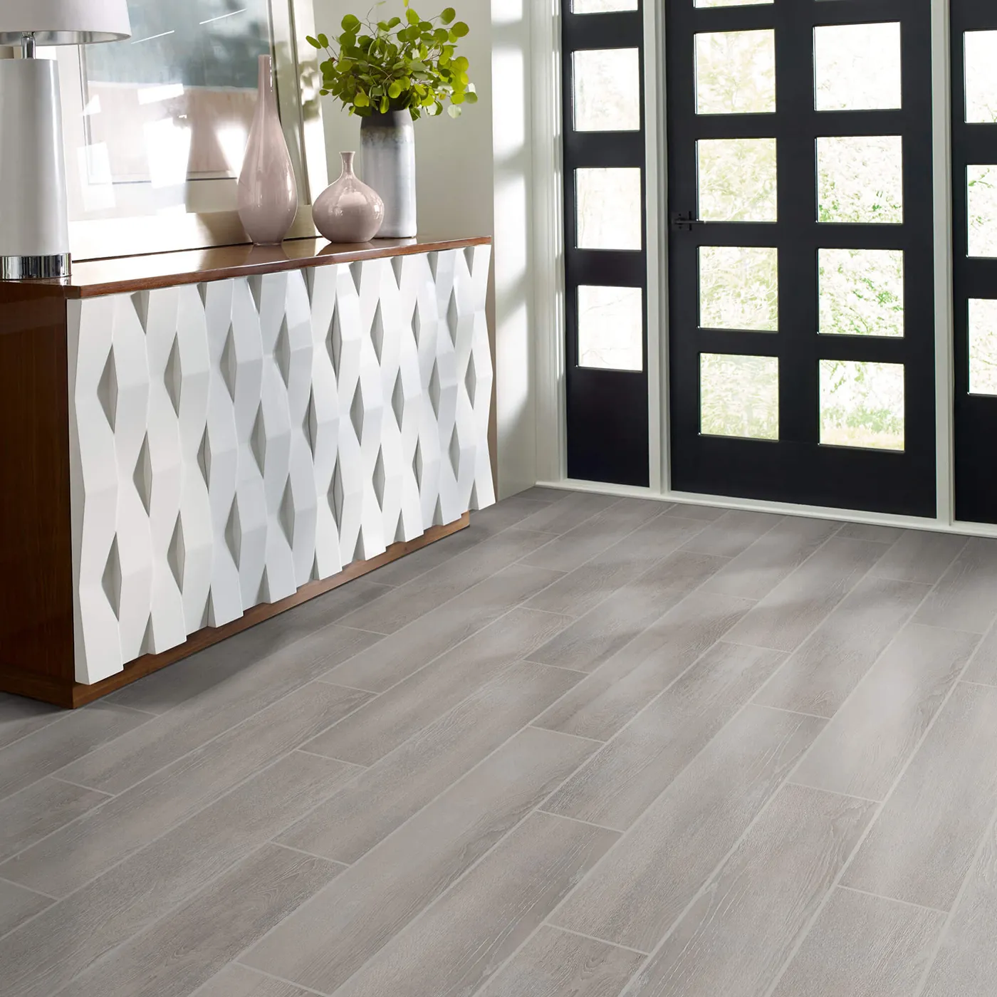 Tile with a light gray wood look, in an entryway | Kirkland's Flooring