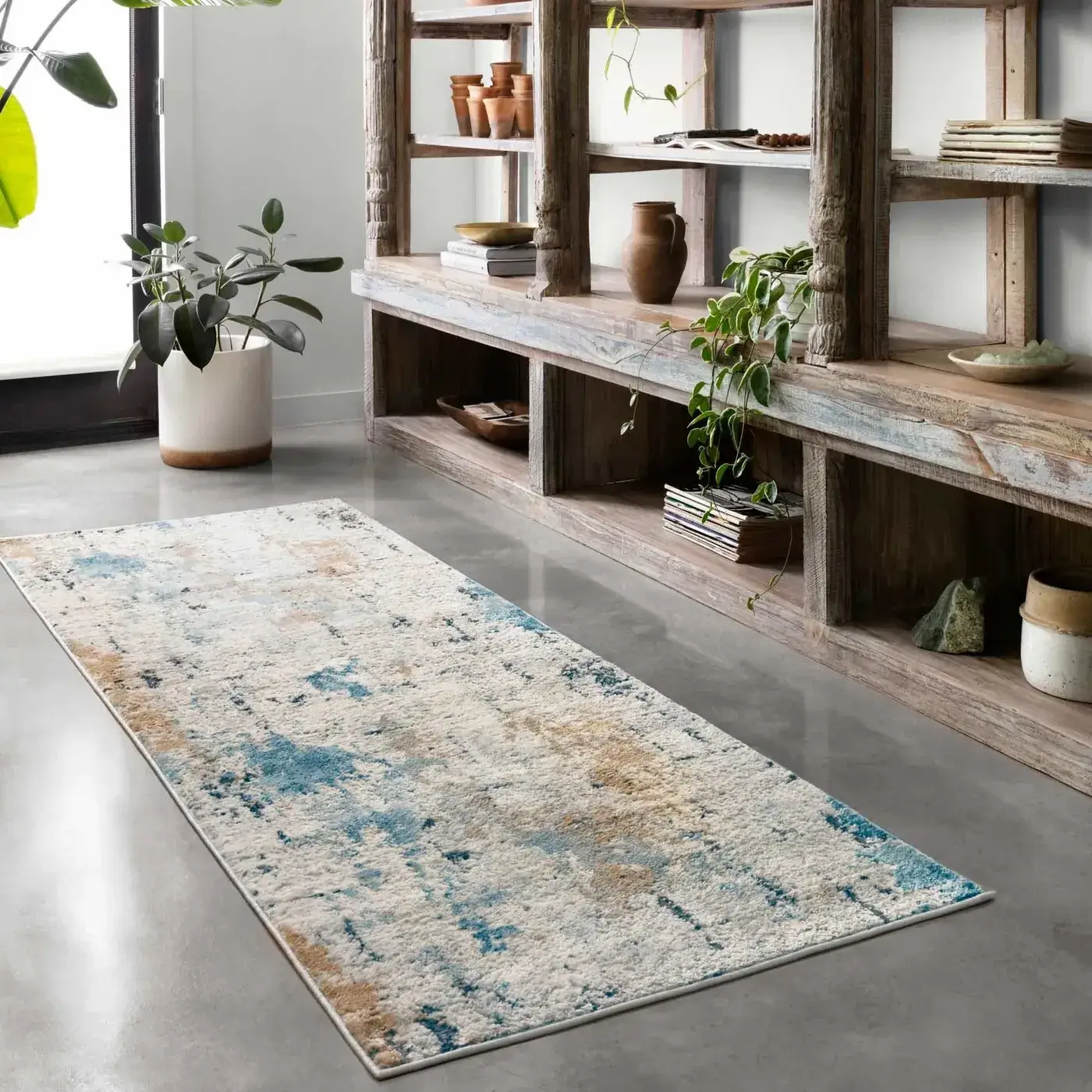 Loloi area rug in a distressed white, blue, and brown abstract pattern | Kirkland's Flooring