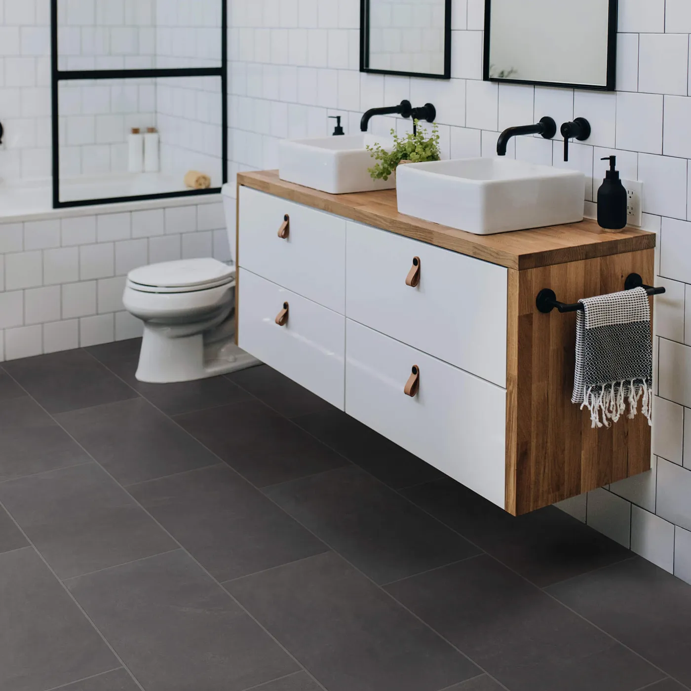 Shaw Floors Ember dark gray rectangular tile in a modern bathroom | Kirkland's Flooring