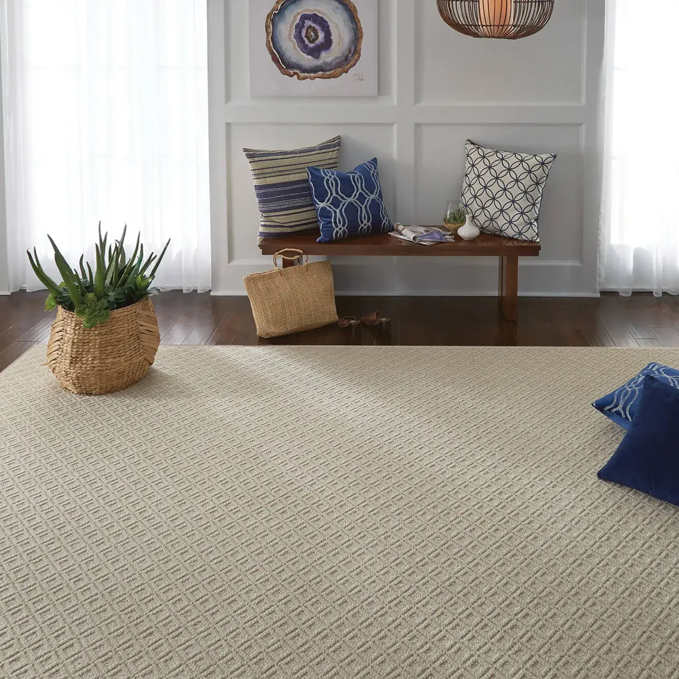 A Shaw Floors area rug in a light sand color | Kirkland's Flooring