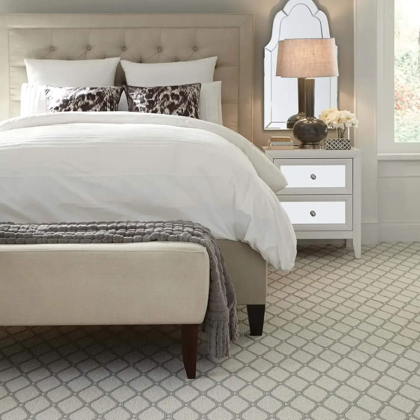 White and gray patterned carpet in a bedroom | Kirkland's Flooring