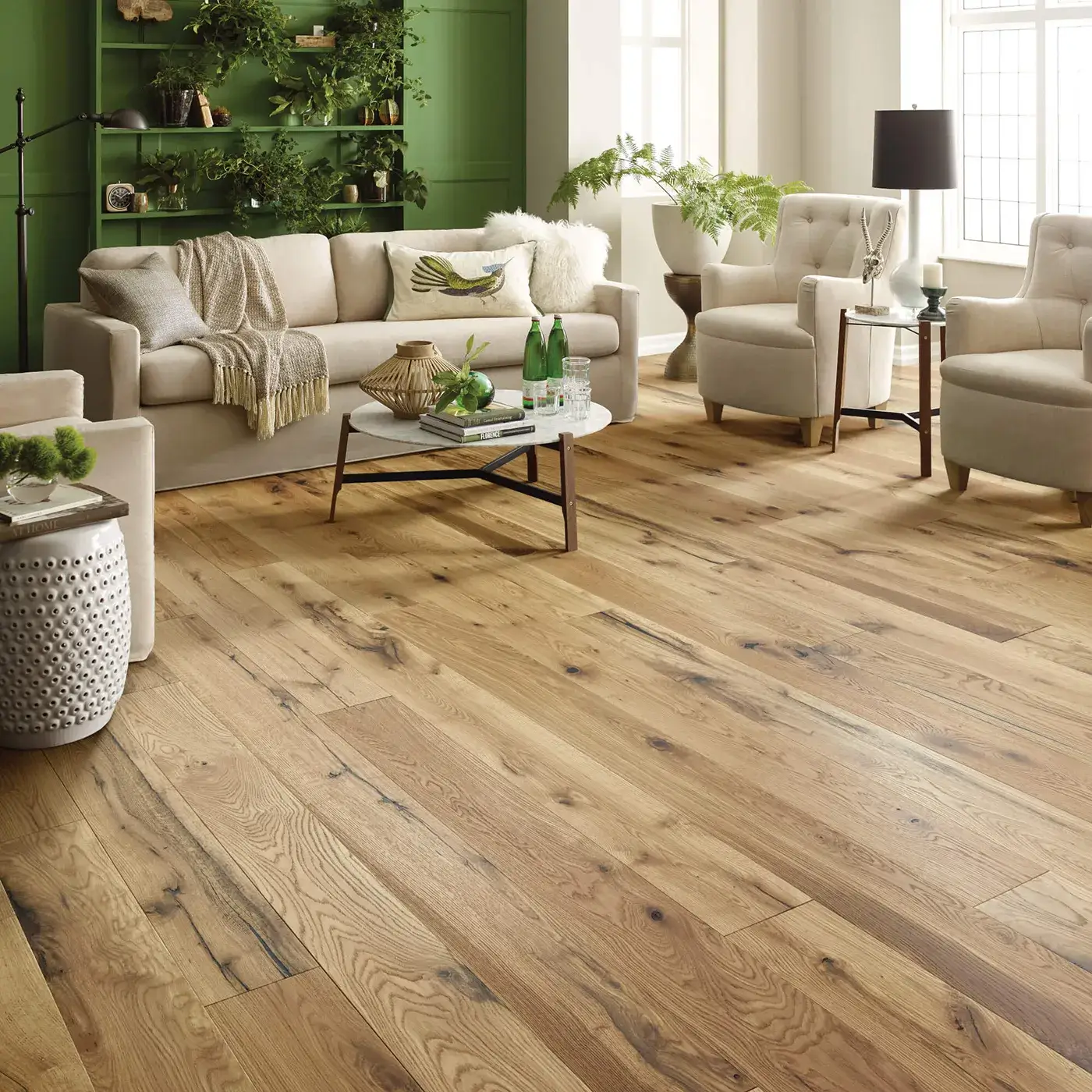 Gray-brown hardwood in a dining room with a dark wood table | Kirkland's Flooring