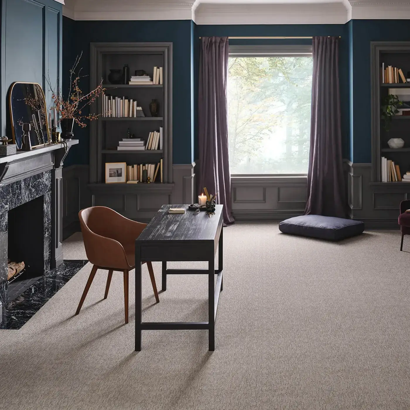 Beige-gray Shaw Floors carpet in a darkly lit residential office | Kirkland's Flooring