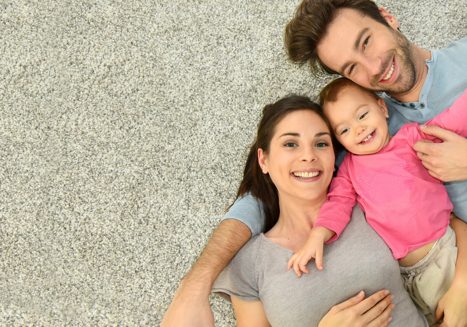 Family laying on Carpet | Kirkland's Flooring